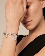 Bracciale UNOde50 di perline, elemento tubolare e piastrina con messaggio placcato argento Ref. PUL1210